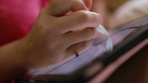 Close-up hand using digital pen drawing on computer tablet Stock Footage 167785939