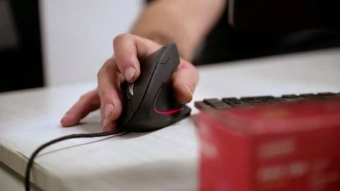 Close-Up of a Hand Using an Ergonomic Vertical Computer Mouse Stock Footage 318304578