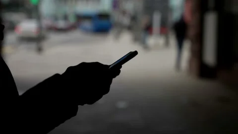 Close-up of the hand using the function of writing a smartphone message online Stock Footage 153483493