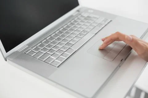 Close up of a hand using laptop Stock Photos