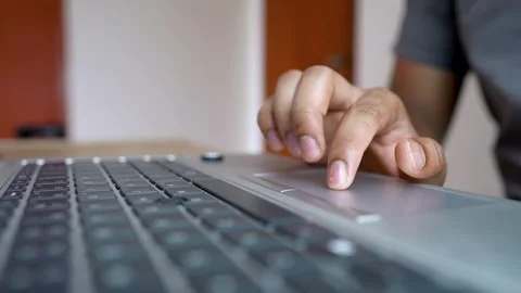 Close-Up of Hand Using Laptop Touchpad, Close-Up of Hands Typing on Laptop .. Stock Footage 315982873