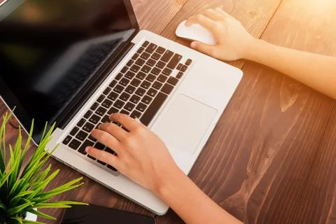 Close up hand using laptop working in office Stock Photos