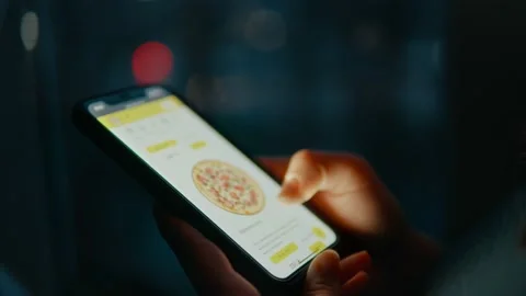 Close-up of a hand using a mobile phone making an online order. Stock Footage 239377415