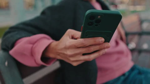 Close-Up of Hand Using Mobile Phone Outdoors Stock Footage 337713110