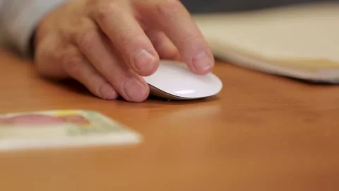 Close-Up of Hand Using a Mouse at a Modern Office Desk Stock Footage 297370854