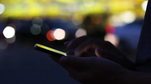 Close-up hand using phone in the city on night Stock Footage 69009390