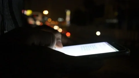 Close-up hand using phone in night time on street Stock Footage 81763284