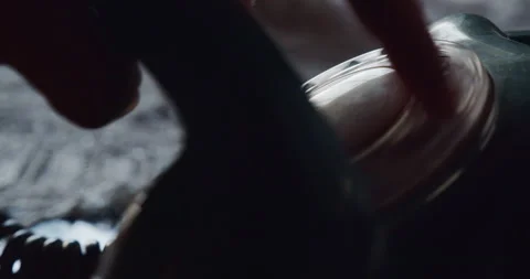 Close-up of a hand using a rotary dial to make a phone call Stock Footage 238013141