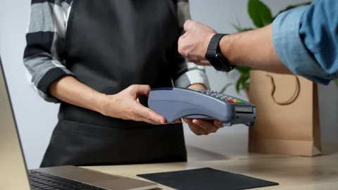 Close-up of hand using smart watch for paying on POS terminal Stock Footage 254339579