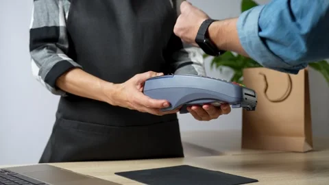 Close-up of hand using smart watch for paying on POS terminal Stock Footage 254339670