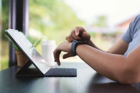 Close up hand using smart watch technology Stock Photos