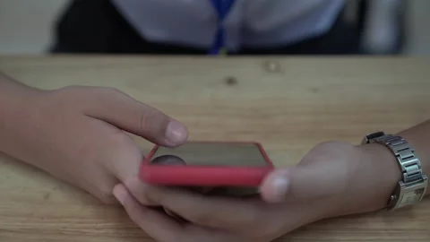 Close up hand using smartphone for education tesr in classroom Stock Footage 163079043