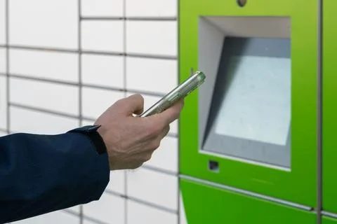 Close up of hand using smartphone for getting code for touchscreen interface Stock Photos