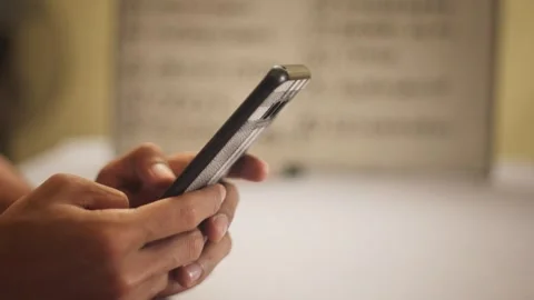 Close Up of Hand Using Smartphone Indoors Stock Footage 344235800
