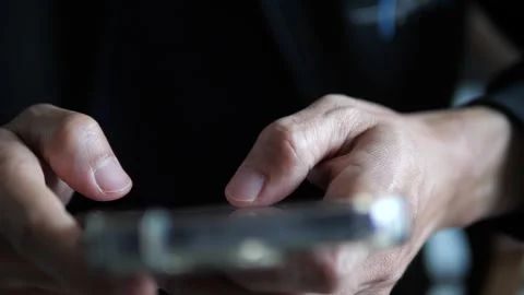 Close Up Hand Using Smartphone in Modern Indoor Setting with Soft Light Stock Footage 325236734