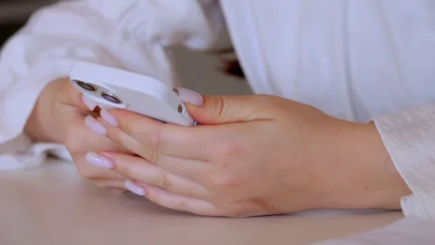 Close-up of hand using smartphone on moving escalator Stock Footage 330106878