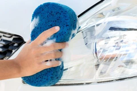 Close up hand using sponge washing car Stock Photos
