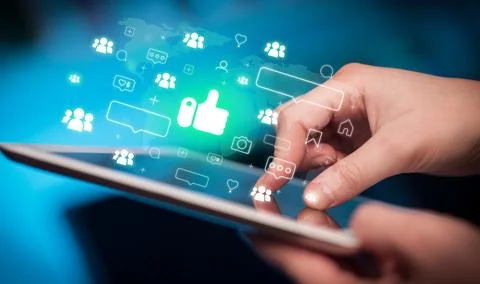 Close-up of a hand using tablet, social media concept Stock Photos