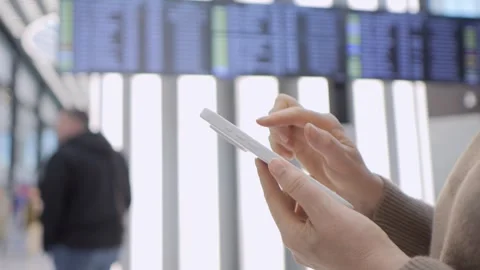 Close-up of hand using tablet while waiting for flight Stock Footage 341509266