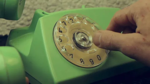 Close-up of a hand using a vintage mint green rotary telephone 스톡 동영상 337207337