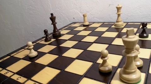 Close up hand using white queen checkmate the black king Stock Footage 112946838