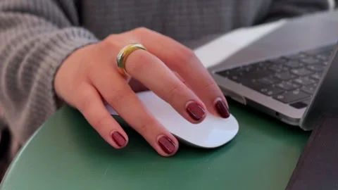 Close-Up of Hand Using Wireless Mouse Beside Laptop in Workspace 스톡 동영상 327293631