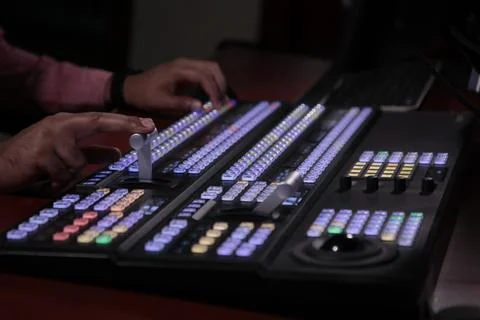 Close up hand on video switcher panel 스톡 사진