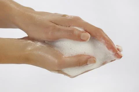 Close-up of hand washing, soaping hands 写真素材
