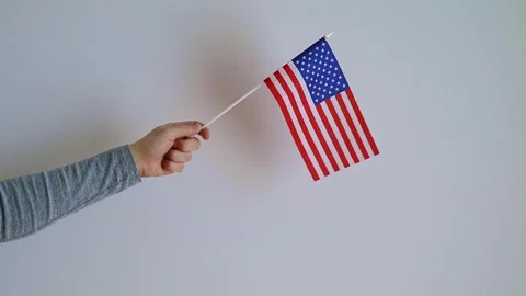 Close up of a hand waving the US flag. Stock Footage 240108580
