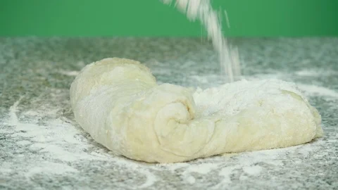 Close up of hand while mix dough for bakery goods on the table top - green sc Stock Footage 126605944