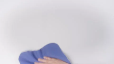 Close up Hand wipe white table with blue rug top view Video stock 242829816