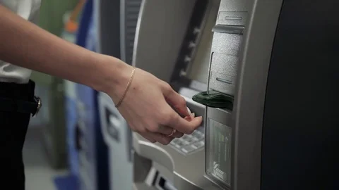 Close up of hand of a woman using banking machine, atm withdrawal with credit Stock Footage 85230579