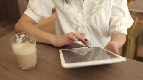Close up Hand Woman Using Tablet in Coffee Shop Stock Footage 74180534
