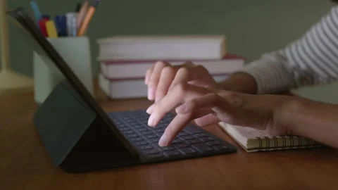 Close up Hand woman using tablet digital on desk typing work at home Stock Footage 143844470