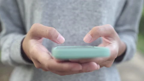 Close up of hand woman using texting smartphone or typing message Stock Footage 163686559