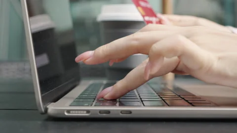 Close up, Hand of woman using, typing laptop in the coffee at the city Stock Footage 274827155