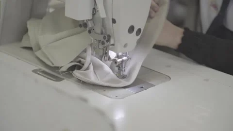 Close-up hand of women using sewing machine Stock Footage 248798493