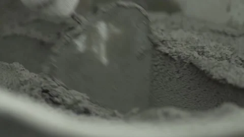 Close-up of the hand of a worker mixing concrete with a trowel Stock Footage 132496209