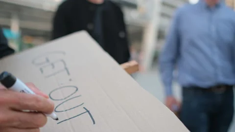 Close up hand write text on banner for protestors to demand or suppliant request Stock-Footage 143504759