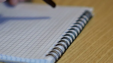 Close up of hand writes on white sheets of paper Video stock 84385631