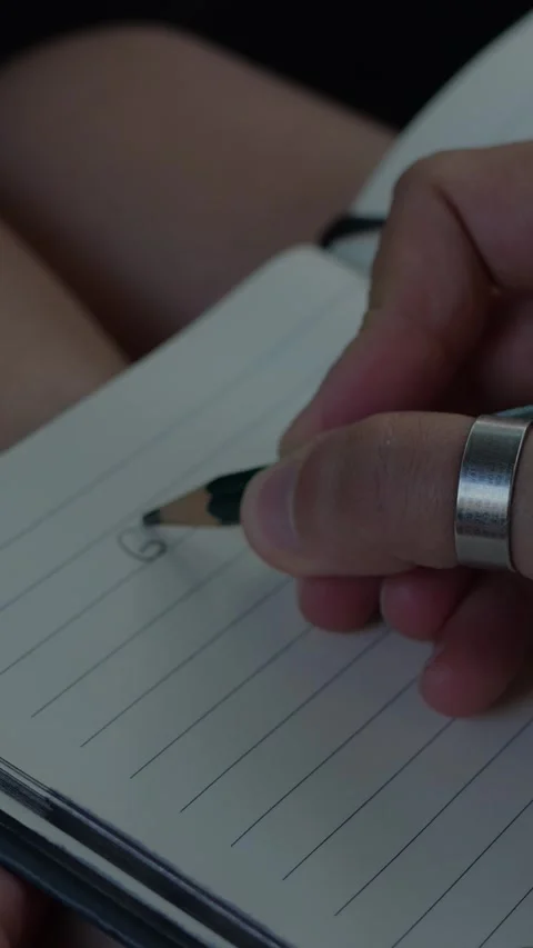 Close-up of a hand writing a 2026 personal goals list with... Stock Footage 344455036
