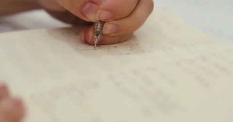 Close-Up of a hand writing guitar notes in a notebook with a pencil Video stock 144612985