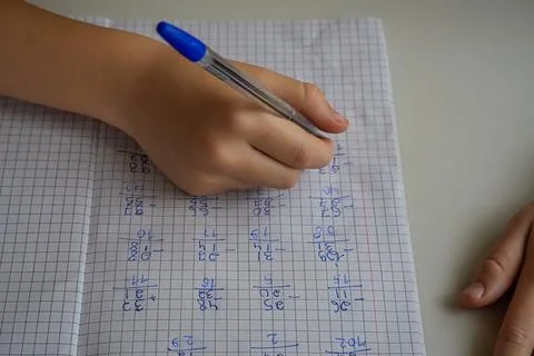 Close-Up of Hand Writing in Notebook with Examples Stock Photos