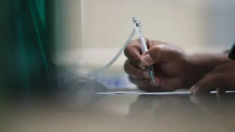 Close Up of Hand Writing Notes on Paper Stock Footage 344235887