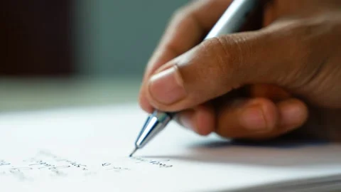 Close-up of hand writing notes with pen, Close-up of a person writing notes.. Stock-Footage 346484167