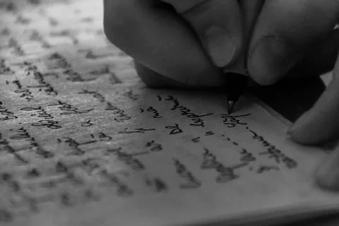 Close-Up Of Hand Writing On Paper Stock Photos