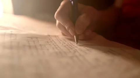 Close-up of a hand writing text, child doing homework. Letters and words closeup 库存影片 273616012