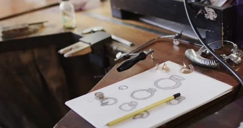 Close up of handcraft tools and design in jewellery studio in slow motion Stock Footage 335568426