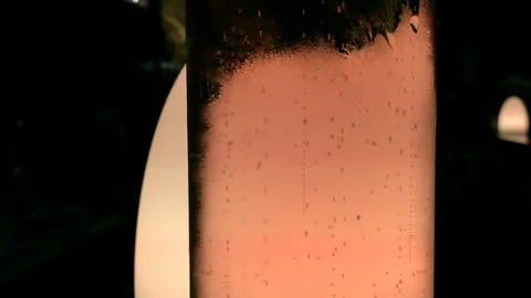 Close-up handheld shot of bubbles rising inside of jug of soda water 스톡 동영상 120430097