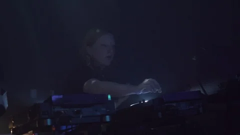 Close-up handheld shot of DJ mixing music on turntable console Stock Footage 114876970